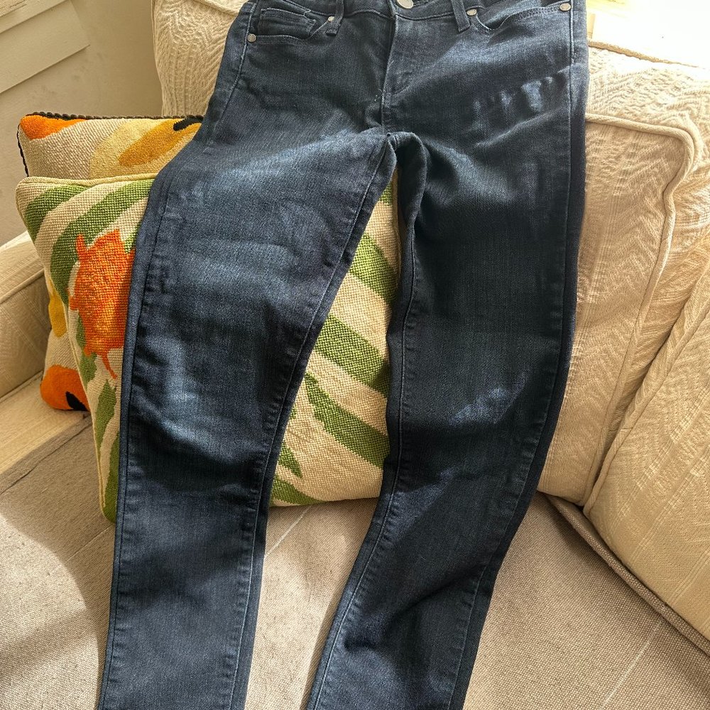 tightly fit Paige jeans.